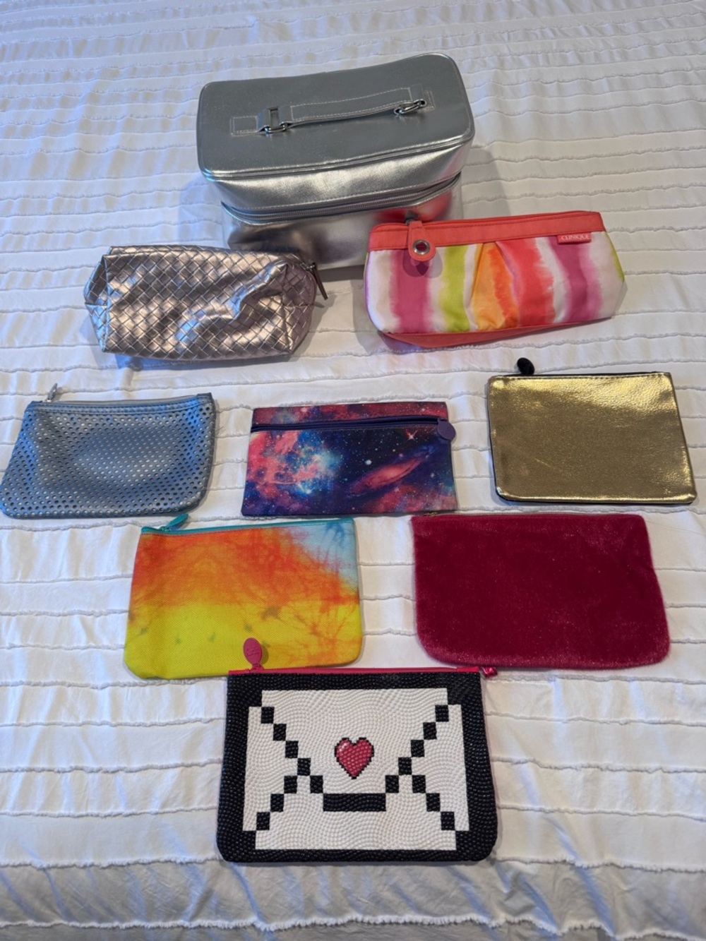 Assorted cosmetic bags —- Clinique and Ipsy